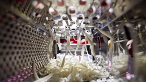 Slow motion close-up video of chef grating cheese. Cutting cheese for pizza Stock Footage 233322800