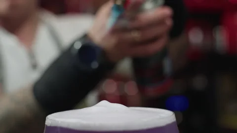 Slow motion close-up video of a fire warming a cocktail on a bar counter. Stock Footage 229660837