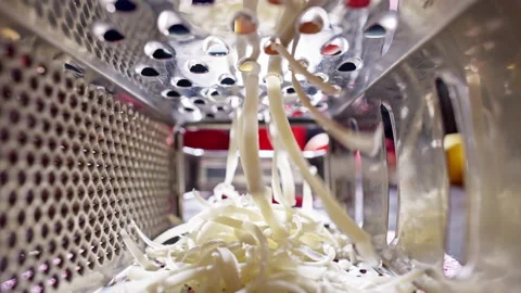 Slow motion close-up video of mozzarella cheese grating. Stock Footage 231911365
