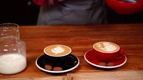 Slow motion close up view on beautiful latte art made with milk on cappuccino Stock Footage 104514644