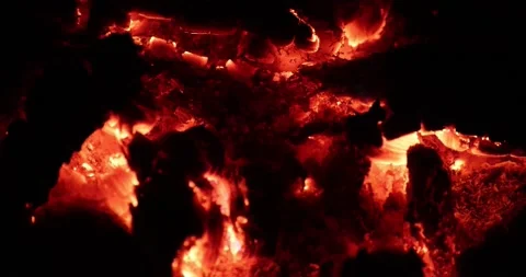 Slow motion close-up view of burning embers from a campfire. Stock Footage 157739256