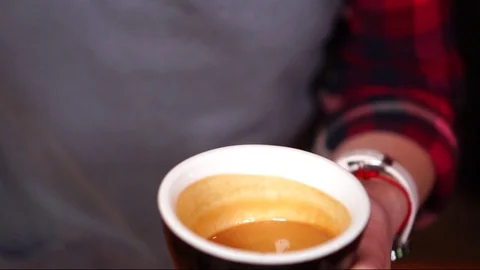 Slow motion close up view on espresso coffee moving wave in small ceramic cup Stock Footage 104513418