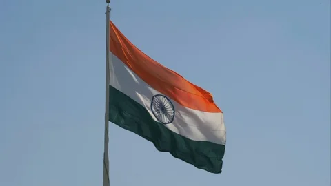 Slow motion close up view of a giant Indian flag fluttering in heavy wind Stock Footage 128723305