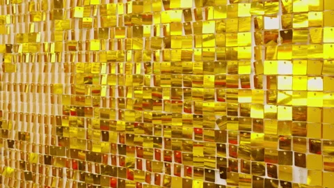 Slow Motion Close View of Gold Sequin Wall with Square Plates Gently Flipping an Stock Footage 323675306