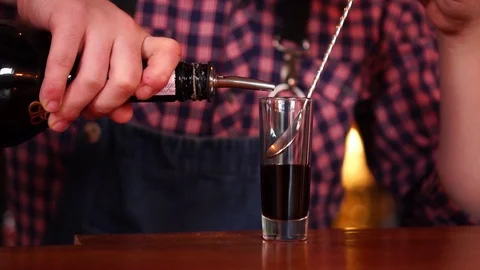 Slow motion close up view on professional male bartender preparing coffee flavor Stock Footage 103804859
