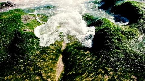 Slow motion close up view of small tide wave coming to beach Video stock 99136710