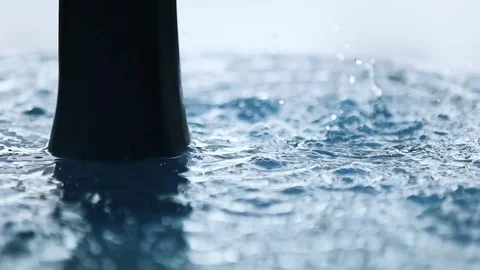 Slow motion close up view of water drops from a fountain Stock Footage 98073193
