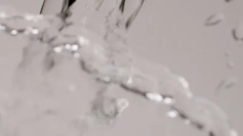 Slow Motion Close Up Water Pour on White Background Stock Footage 107938738