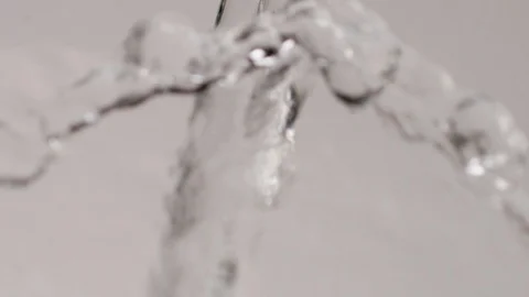 Slow Motion Close Up Water Pour on White Background Stock Footage 107938771