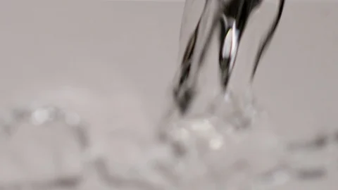 Slow Motion Close Up Water Pour on White Background Stock Footage 107938815