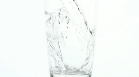 Slow motion close up of water pouring into a glass, with bubbles swirling. 스톡 동영상 34665222