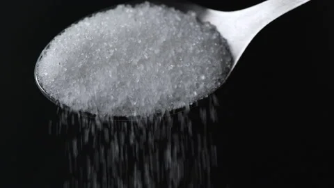 Slow Motion Close Up White Sugar Crystals Falling Off Spoon. Stock Footage 174281101