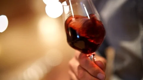 Slow motion close up of winemaker tasting red wine Stock Footage