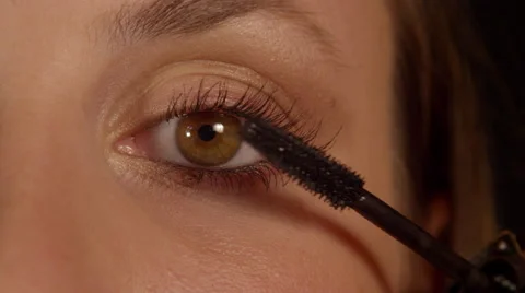 SLOW MOTION CLOSE UP: Woman applying mascara Stock Footage 45997724