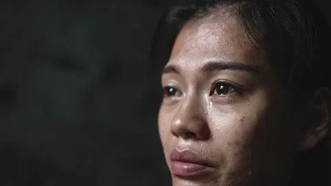 Slow motion, Close-up of a woman crying, tears streaming down her face. Conce Stock Footage 201995289