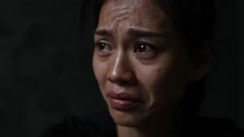 Slow motion, Close-up of a woman crying, tears streaming down her face. Conce 스톡 동영상 203805535