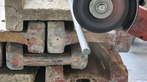 Slow Motion Close Up of Worker Cutting Steel Pipe with Angle Grinder 4K Stock Footage 334456526