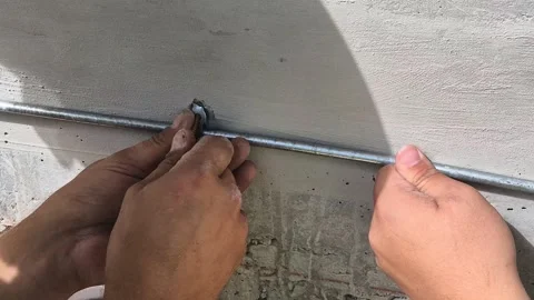 Slow Motion Close-up of Worker Installing Lightning Protection Stock Footage 341104506