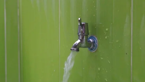 Slow motion close up of young kid hand turning off water Stock Footage 87189600