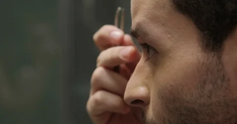 Slow Motion Close Up Young Man Plucking His Eyebrows Stock Footage 100352178