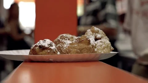 Slow Motion Close up Zeppoli blurred people in background Williamsburg Brooklyn Vídeos de archivo 252330748
