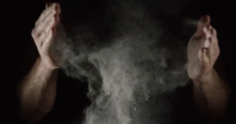 SLOW MOTION closeup of an athlete hands clapping with white chalk powder Stock Footage 64078774