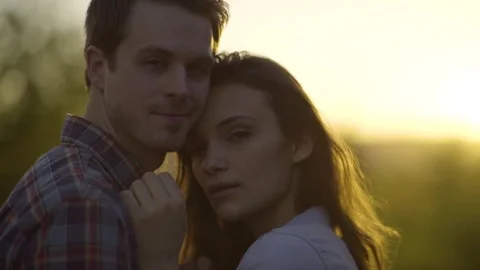 Slow Motion Closeup Of Beautiful Multiracial Couple Looking At Camera, In Nature Stock Footage 76011062
