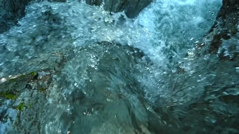 Slow motion of a closeup of a beautiful waterfall between stones of a rivulet Stock-Footage 211493214
