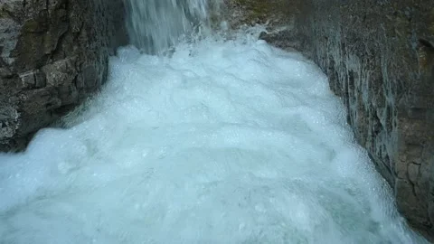 Slow motion of a closeup of a beautiful waterfall in between rocks Stock Footage 211498379