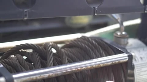 Slow motion closeup of cable puller on front of 4x4 vehicle 스톡 동영상 255867360