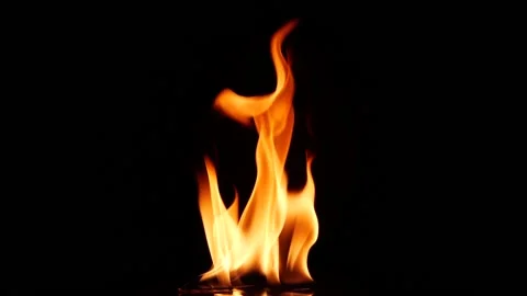 Slow motion closeup campfire burn on black background, fire flame design element Stockbeeldmateriaal 146154204