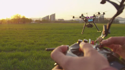 SLOW MOTION CLOSEUP: Drone operator holding a transmitter Stock Footage 37120190