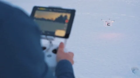 SLOW MOTION CLOSEUP: Drone operator holding a transmitter Stock Footage 71479520