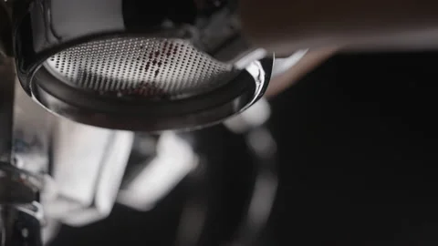 Slow motion closeup espresso extraction from naked portafilter Stock Footage 169786704