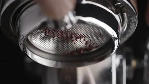 Slow motion closeup espresso extraction from naked portafilter Stock Footage 169787091