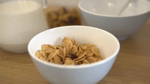 Slow motion closeup falling flakes with dry fruits 動画素材 88709506