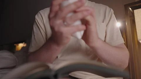 Slow motion closeup of a frustrated man's hands ripping a paper page out of a 스톡 동영상 328988786