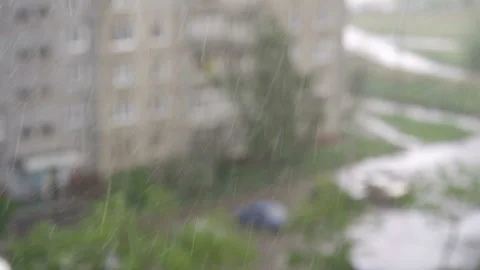 Slow motion closeup of heavy rain falling down in the street Video stock 92474713