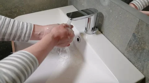Slow Motion. Closeup of Human Hand Under Stream of Pure Water From Tap. Stock Footage 247794688