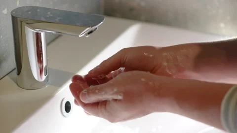 Slow Motion. Closeup of Human Hand Under Stream of Pure Water From Tap. Stock Footage 247794697