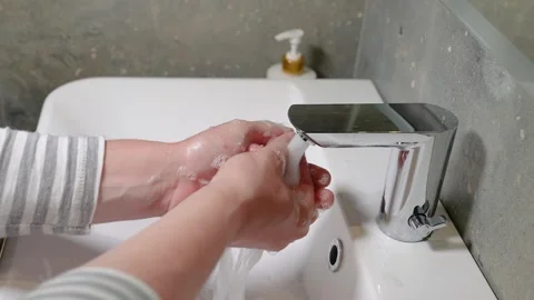Slow Motion. Closeup of Human Hand Under Stream of Pure Water From Tap. Stock Footage 247794755