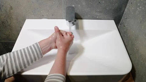 Slow Motion. Closeup of Human Hand Under Stream of Pure Water From Tap. Stock Footage 247794805