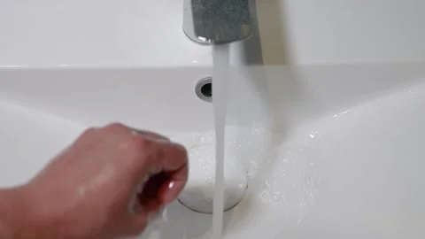 Slow Motion. Closeup of Human Hand Under Stream of Pure Water From Tap. Stock Footage 247794808