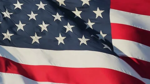 Slow Motion Closeup of Large American (USA) Flag Rippling In Strong Wind Stock Footage 64399476