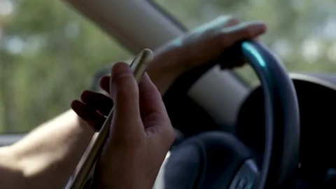 Slow Motion Closeup Of Man Driving, Receives A Phone Call, Brings Phone To Ear Stock Footage 79581225