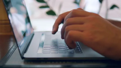 Slow motion. Closeup man hands typing message on keyboard using laptop. 4k UHD Stock Footage 146452822