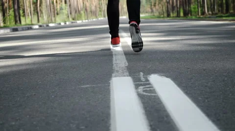 SLOW MOTION Closeup of man jogging and training for marathon. Stock Footage 63057464