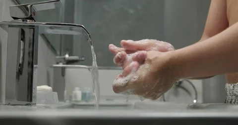 Slow Motion Closeup of Man Washing His Hands With Soap Stock Footage 100357639