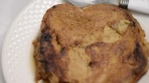 Slow-motion closeup pan of toronjas - sweet wine-soaked Easter Week bread w.. Vídeo Stock 306728245