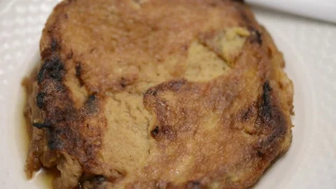 Slow-motion closeup pan of toronjas - sweet wine-soaked Easter Week bread w.. Vídeo Stock 306728260